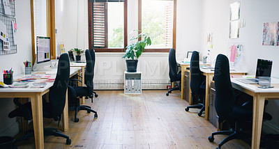 Buy stock photo Office, empty and interior for workspace, creative agency or design studio for organisation career. Chairs, desks and laptops for project tasks, research and online assessment with window for decor