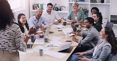 Buy stock photo Businesspeople, presentation with leader planning and with laptop at desk in a office at their workplace. Teamwork or collaboration, business meeting and colleagues discussing together in a boardroom