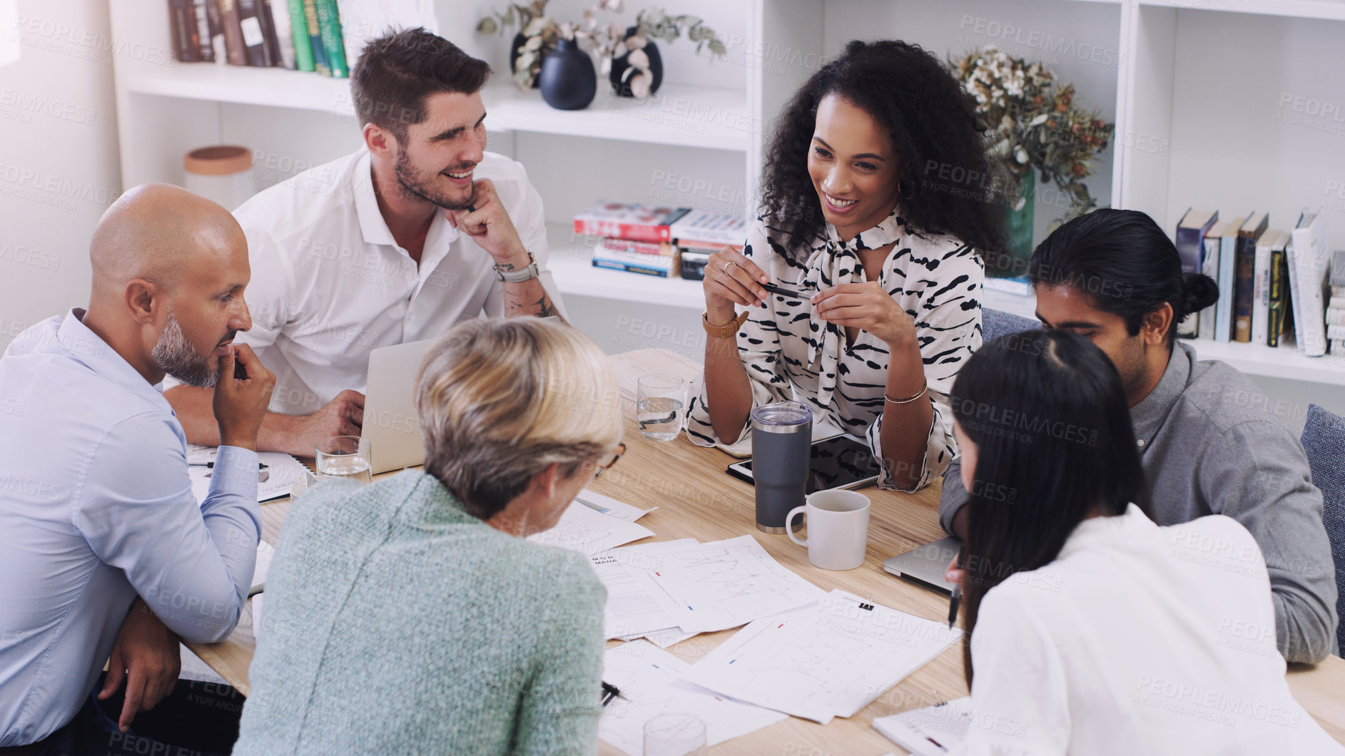 Buy stock photo Shot of a group of businesspeople having a meeting in a modern office