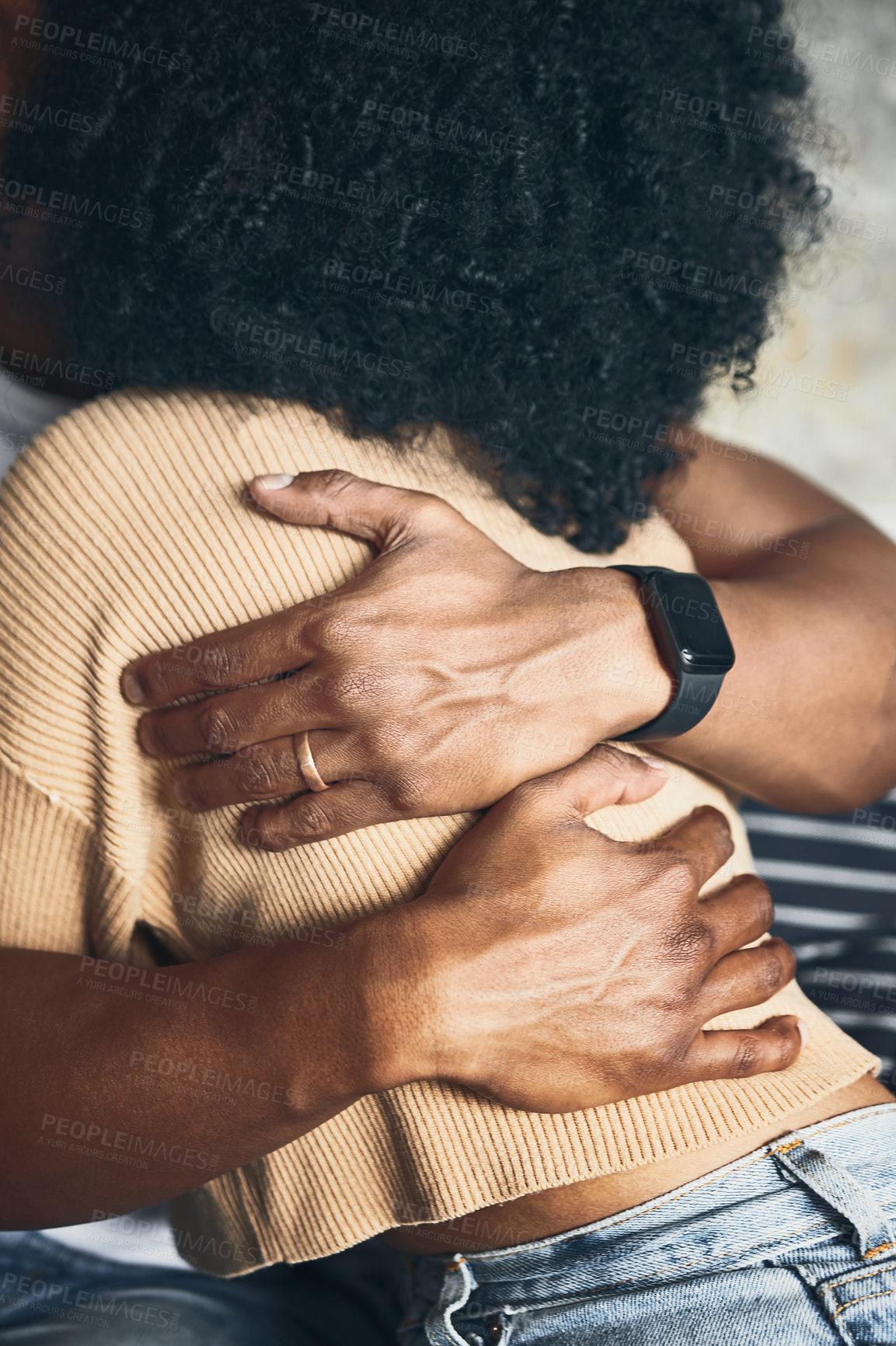 Buy stock photo Closeup shot of a couple hugging each other at home