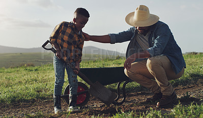 Buy stock photo Farm, agriculture and father and kid help for farming, planting vegetables and dig in soil. Black family, nature and dad with young boy for sustainability, growth and agribusiness in countryside