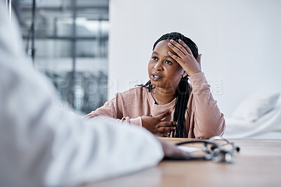 Buy stock photo Shot of a young woman having a consultation with a doctor