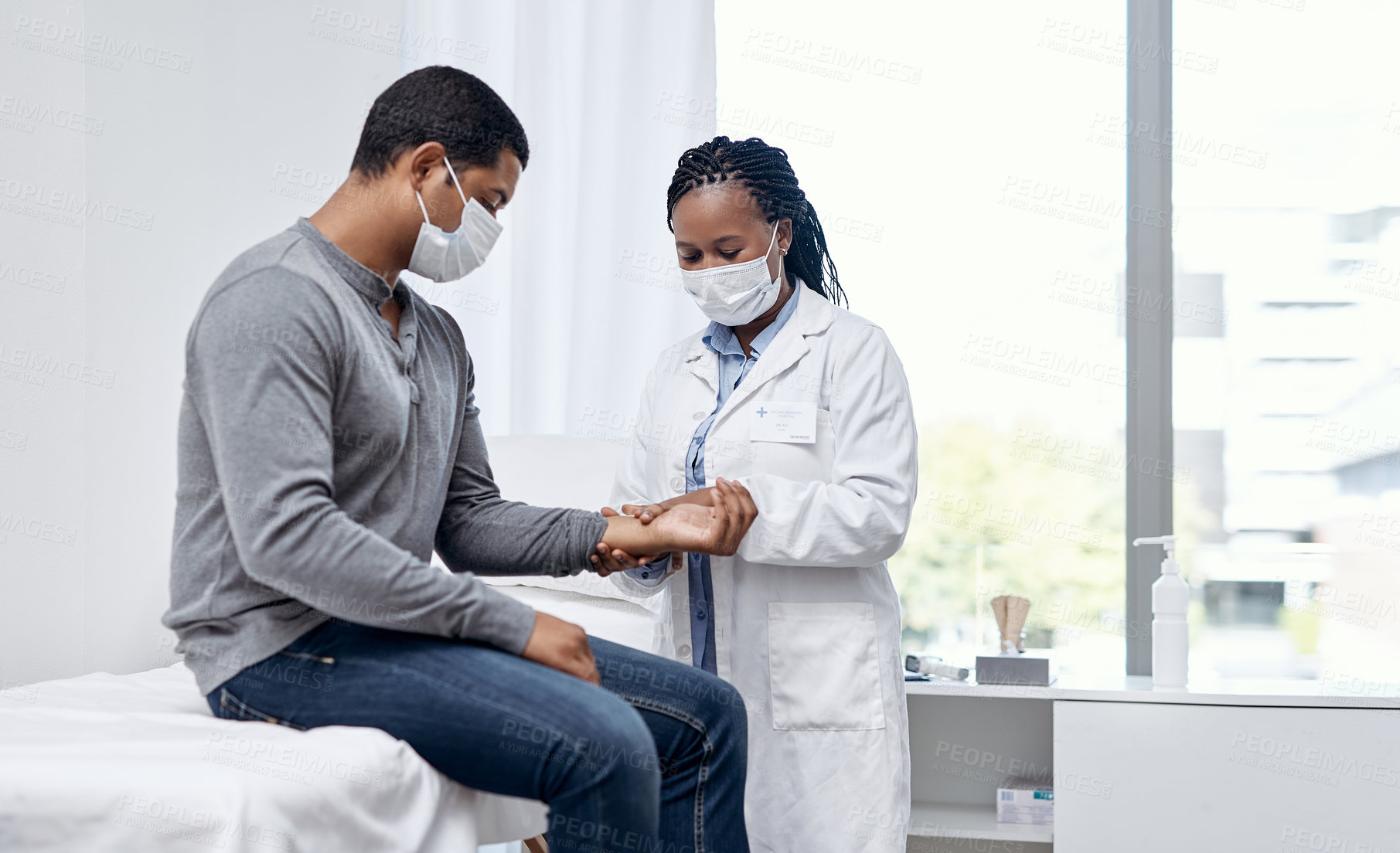 Buy stock photo Shot of a doctor checking a patient's pulse
