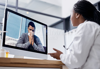 Buy stock photo Shot of a young man blowing his nose during a video call with a doctor on a computer