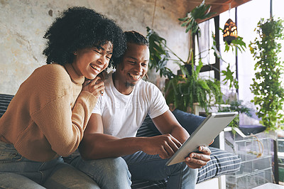 Laugh, home and couple on sofa with tablet for internet, online shopping and streaming website. Dating, weekend and happy African man and woman on digital tech for social network, relax and connected