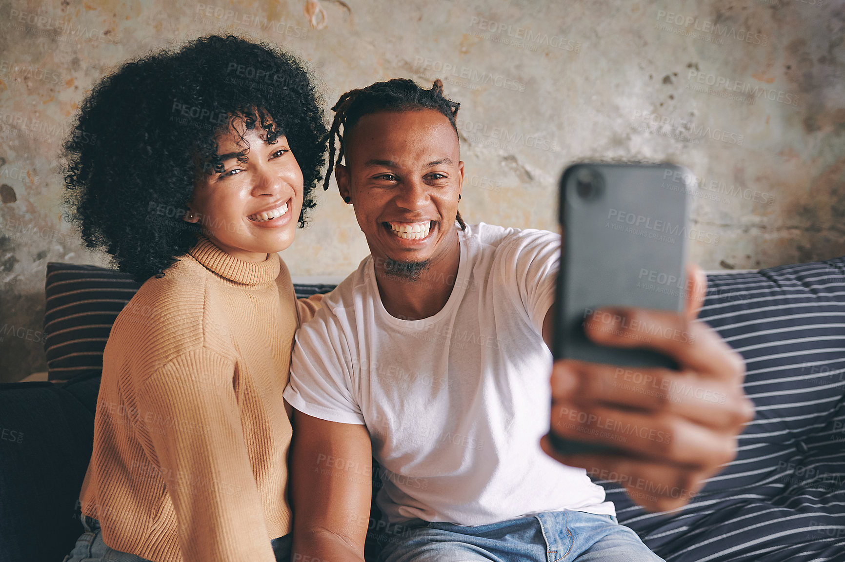 Buy stock photo Happy couple, sofa and picture with selfie for photography, memory or relationship status at home. Man, woman or lovers with smile or relax for capture, moment or social media post on couch at house