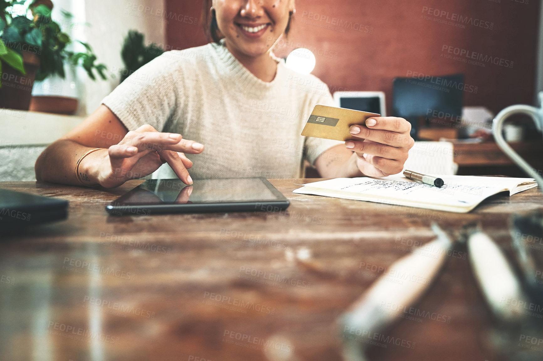 Buy stock photo Happy, woman and tablet with credit card at store of online shopping, order supplies and payment. Female person, digital and ecommerce for transaction password, upgrade inventory and pottery expenses
