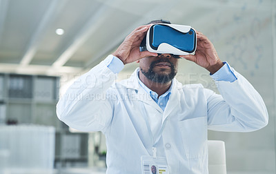 Buy stock photo Shot of a mature scientist using a virtual reality headset while working in a lab