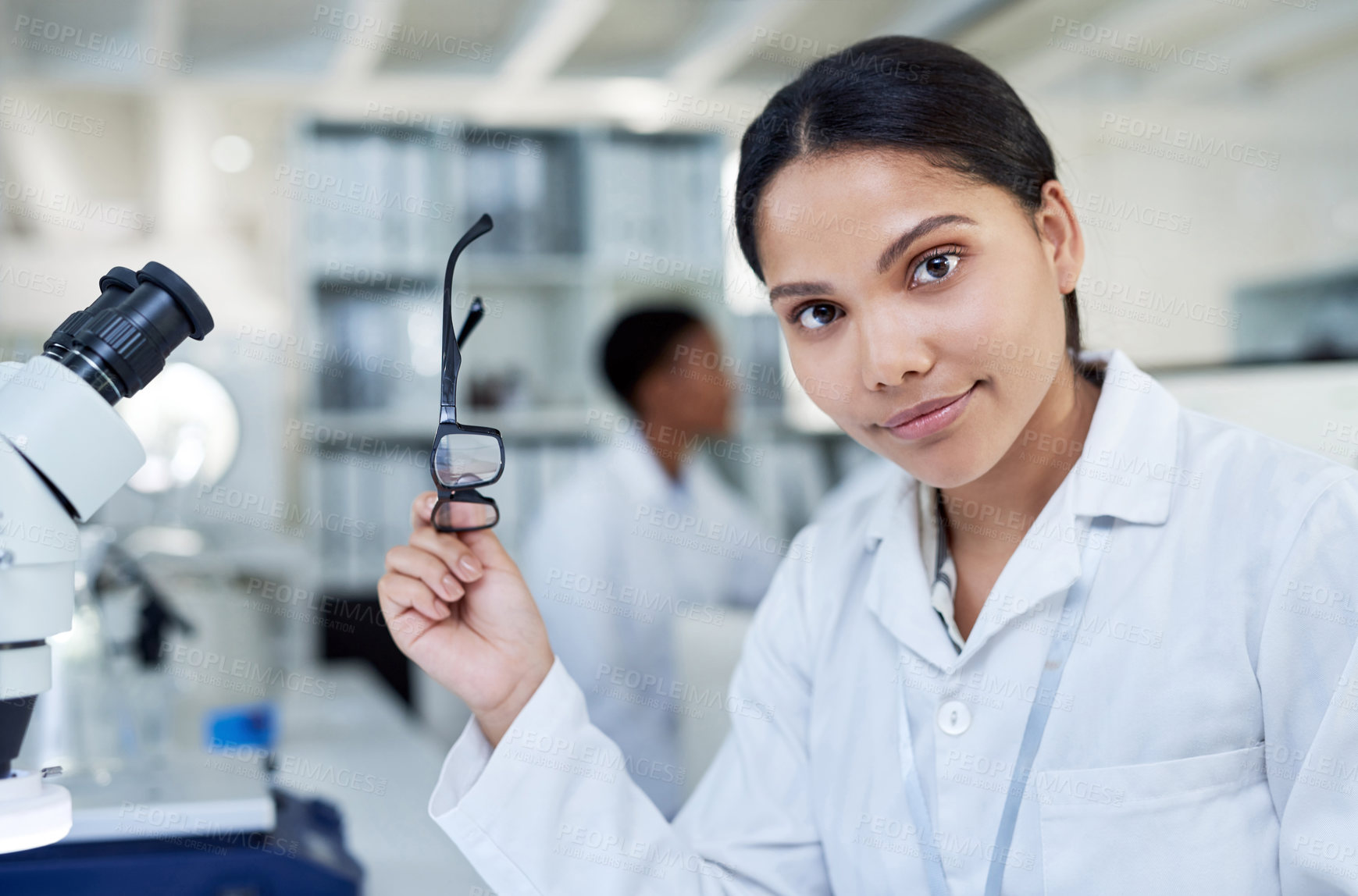 Buy stock photo Portrait of a young scientist working in a lab