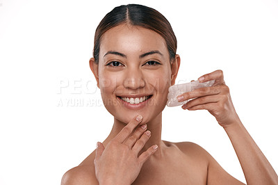 Buy stock photo Shot of a beautiful woman using a Gua Sha tool on her face
