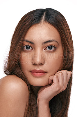 Buy stock photo Studio shot of a beautiful young woman with long brown hair against a white background