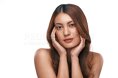 Buy stock photo Studio shot of a beautiful young woman with long brown hair against a white background