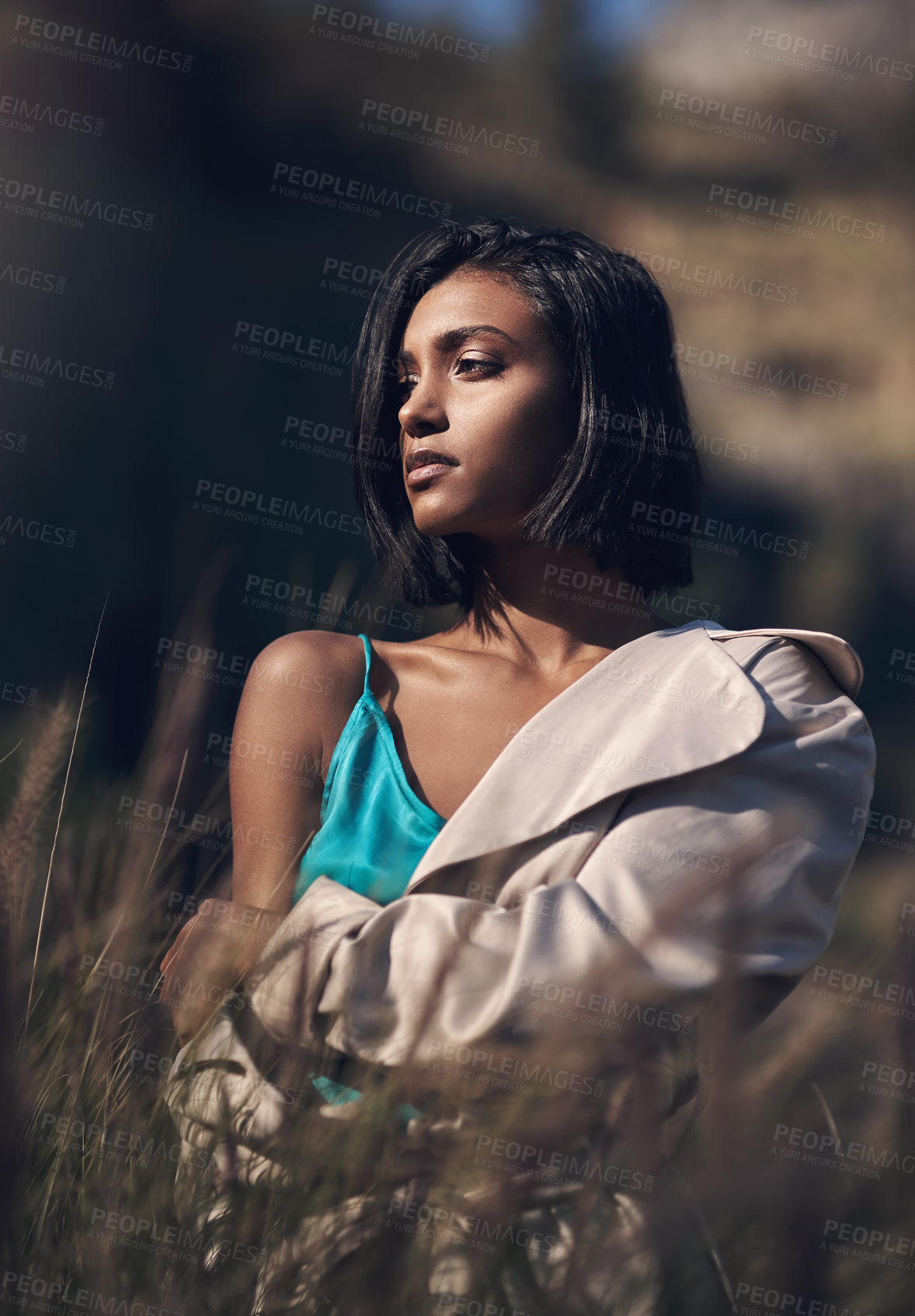 Buy stock photo Shot of a fashionable young woman posing outdoors
