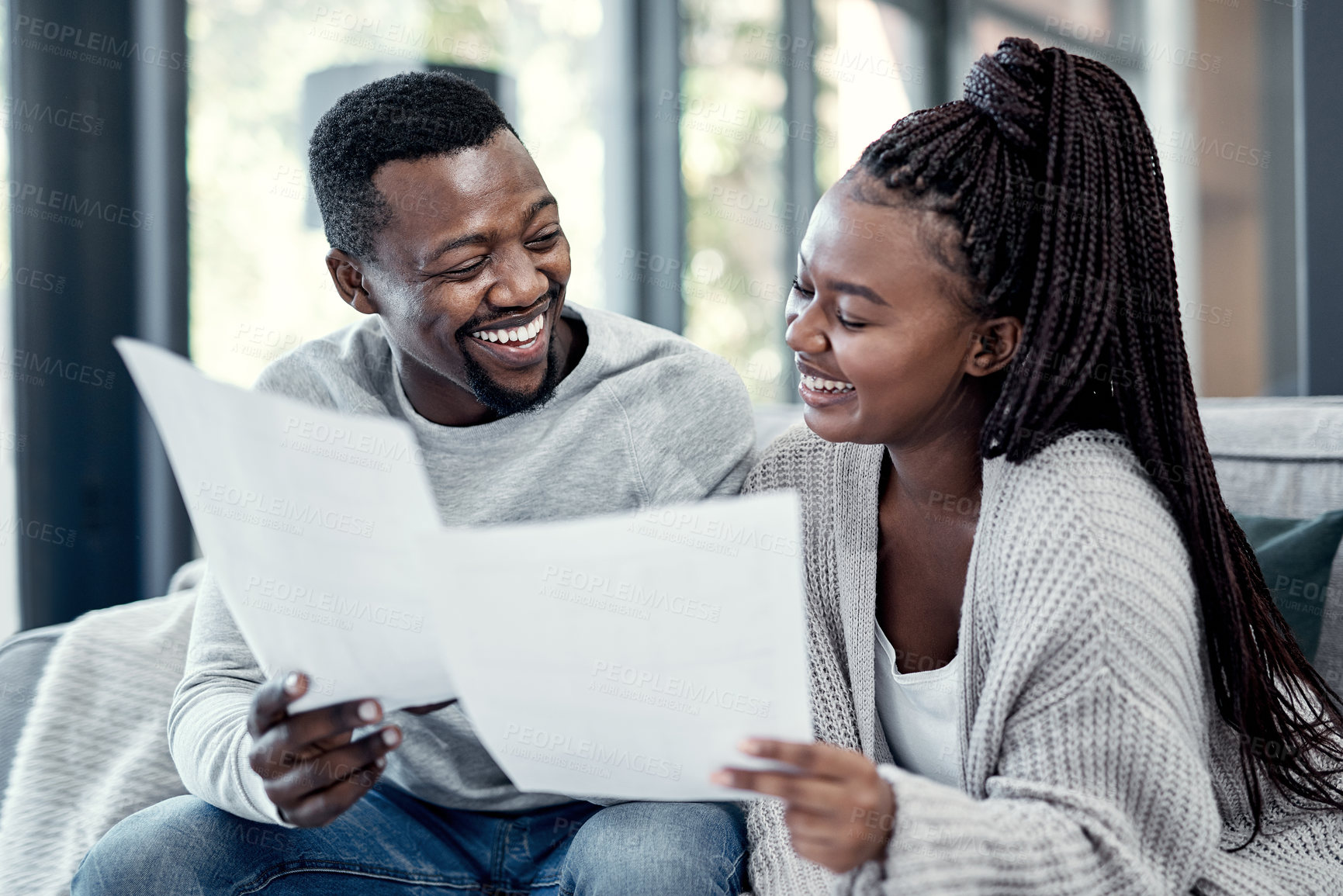 Buy stock photo Home, black couple and happy with paperwork on sofa for finance plan or interest rate on loan application. Apartment, people and smile with documents on couch for bank statement and credit score