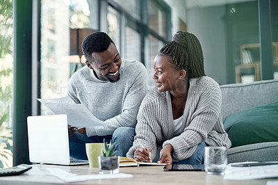 Buy stock photo Couple planning finance investments, insurance and banking bills papers together at home. Happy husband and young wife smiling over their financial budget report information and  household money plan