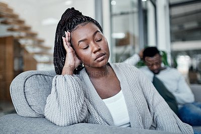 Buy stock photo Sad, frustrated and tired woman ignoring husband during a fight, argument and conflict about divorce, breakup and relationship problems. Unhappy, stressed and depressed wife feeling sad in a marriage