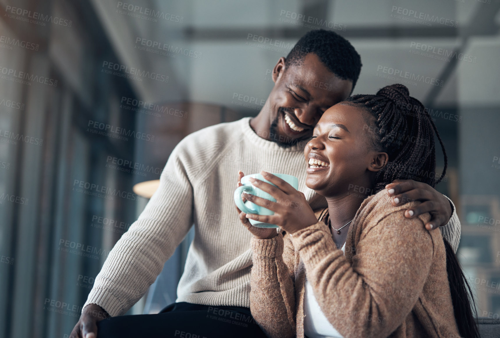 Buy stock photo Cropped shot of an affectionate young couple spending a relaxing day at home together