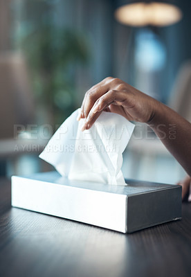 Buy stock photo Cropped shot of an unrecognizable woman taking a facial issue in her home during the day