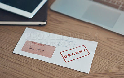 Buy stock photo Still life shot of a letter in an envelope on a table in an office