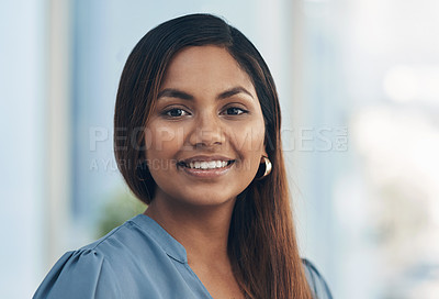 Buy stock photo Portrait of a confident young businesswoman in an office