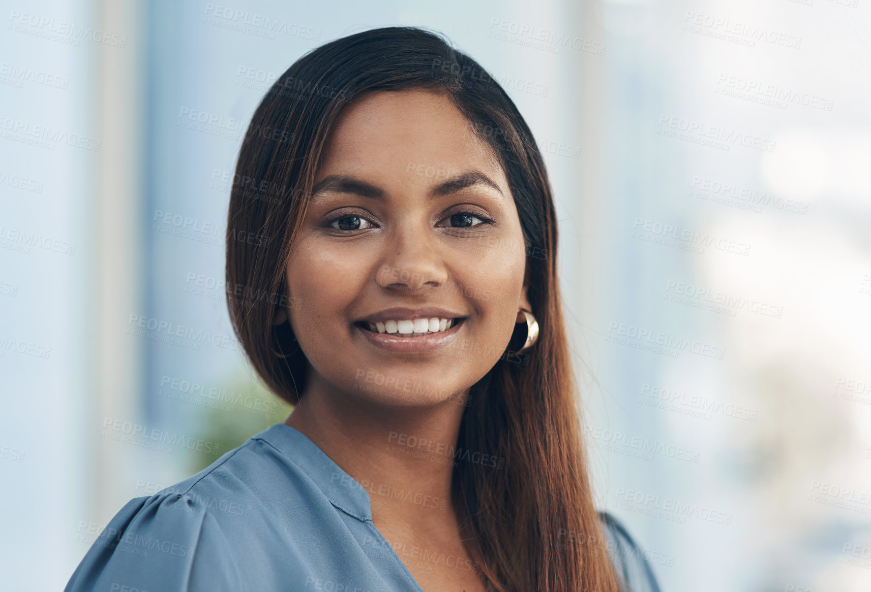 Buy stock photo Portrait of a confident young businesswoman in an office