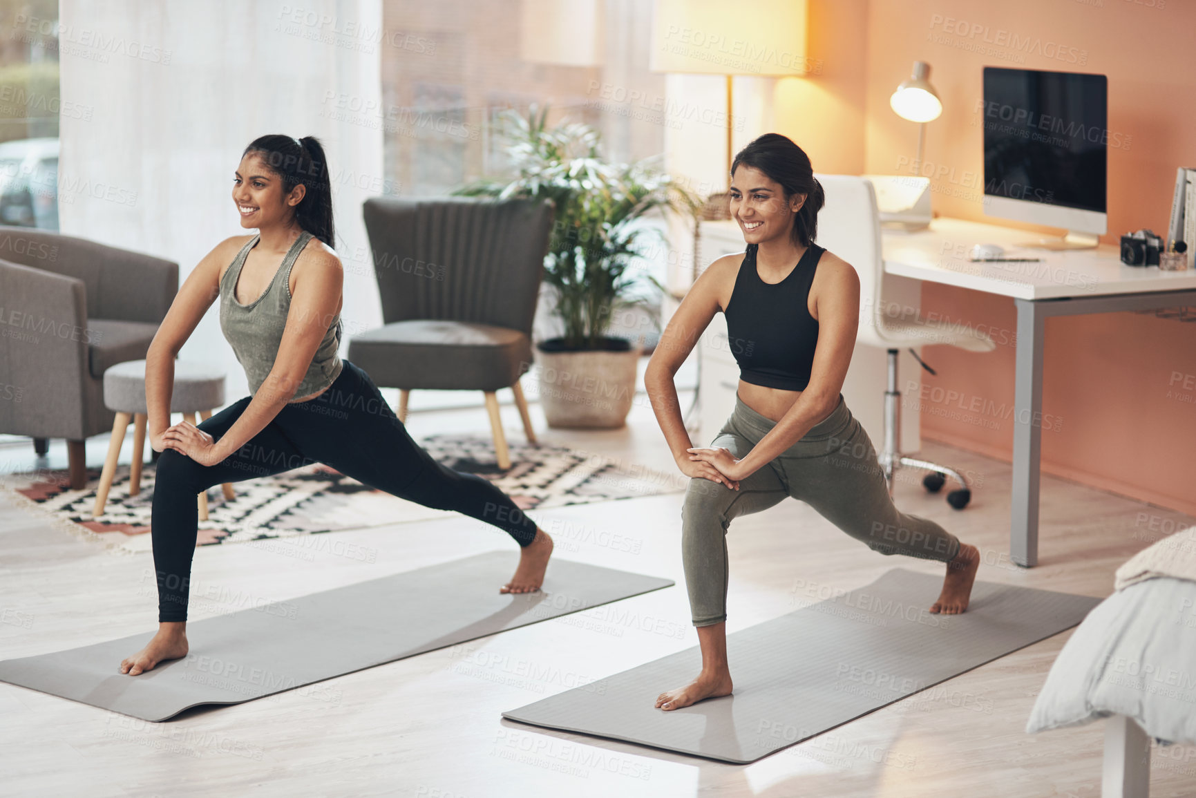 Buy stock photo Women, yoga and friends exercise in a house together with smile, health and wellness. Indian sisters or female family in a lounge while happy about workout, stretching and fitness with a partner