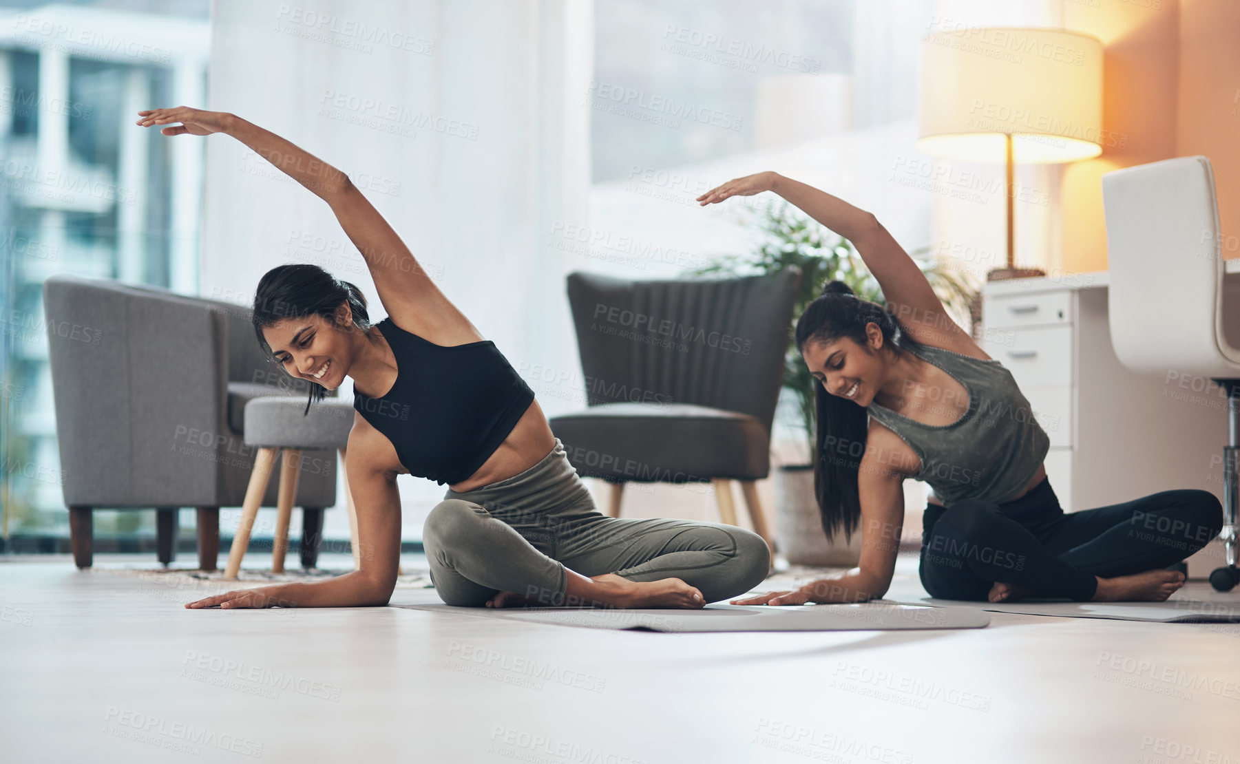 Buy stock photo Women, yoga exercise and friends together in a house with happiness, health and wellness. Indian sisters or female family on lounge floor for stretching workout, balance and fitness with partner