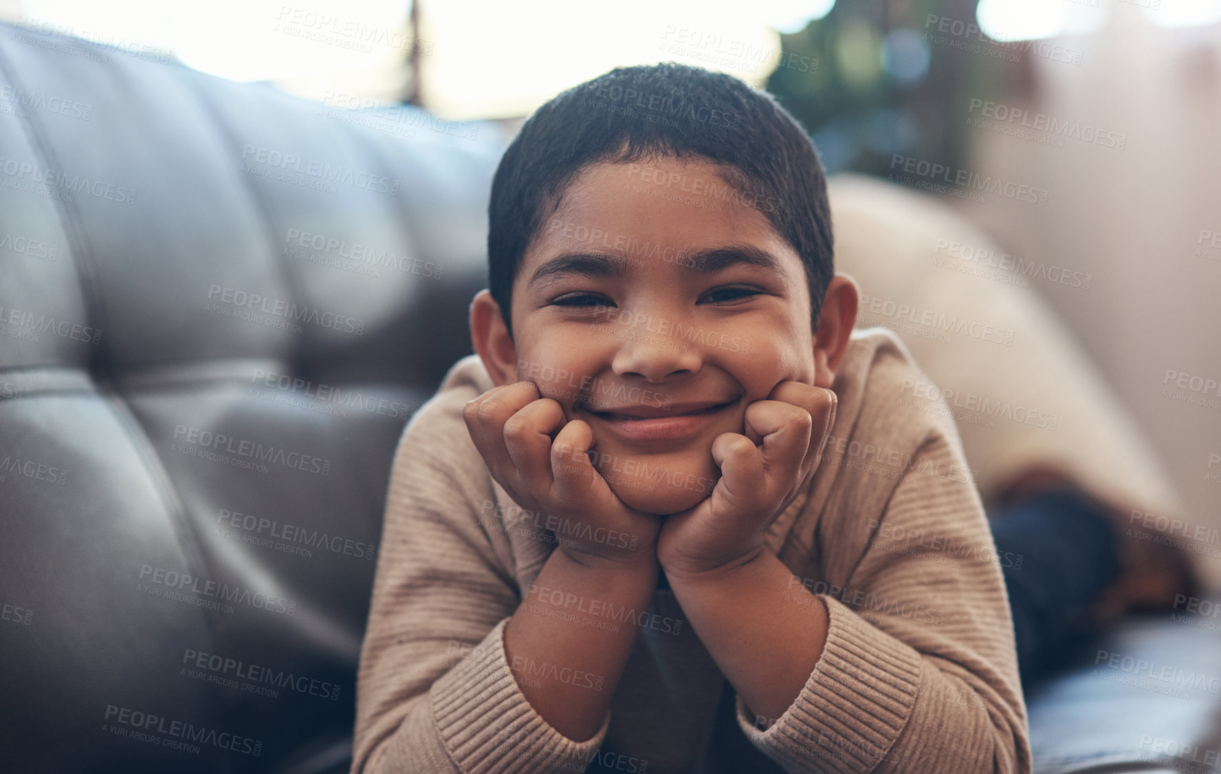 Buy stock photo Portrait, kid and relax on sofa, smile or chill on weekend break with comfort in lounge. Happy, boy and adorable child on couch at home to rest with peace, calm or development with wellness in Brazil