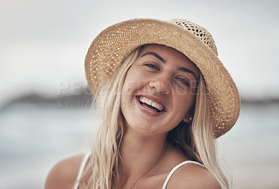 Buy stock photo Shot of a beautiful young woman spending the day at the beach