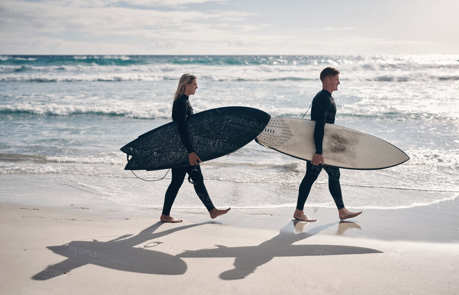 Buy stock photo Walking, surfboard and couple at beach for fitness, water sport and outdoor activity for weekend bonding. Ocean, summer training and people with surfing gear for practice, hobby and travel together