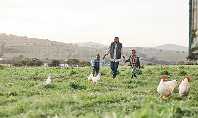 Buy stock photo Shot of a man and his two adorable children exploring a farm