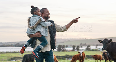 Buy stock photo Shot of a mature man carrying his adorable daughter on a cow farm