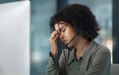 Buy stock photo Cropped shot of a stressed young female agent taking a moment while working in a call centre