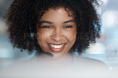 Buy stock photo Cropped shot of a young female agent smiling over her monitor with her headset on while working in a call centre