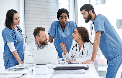 Buy stock photo Shot of a group of medical practitioners having a meeting in a hospital boardroom
