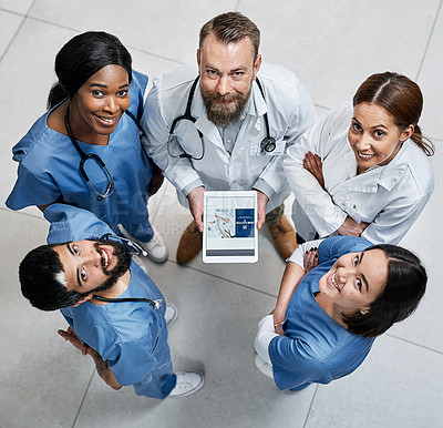 Buy stock photo Portrait of a group of medical practitioners working together in a hospital