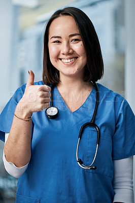 Buy stock photo Portrait of a medical practitioner showing thumbs up in a hospital