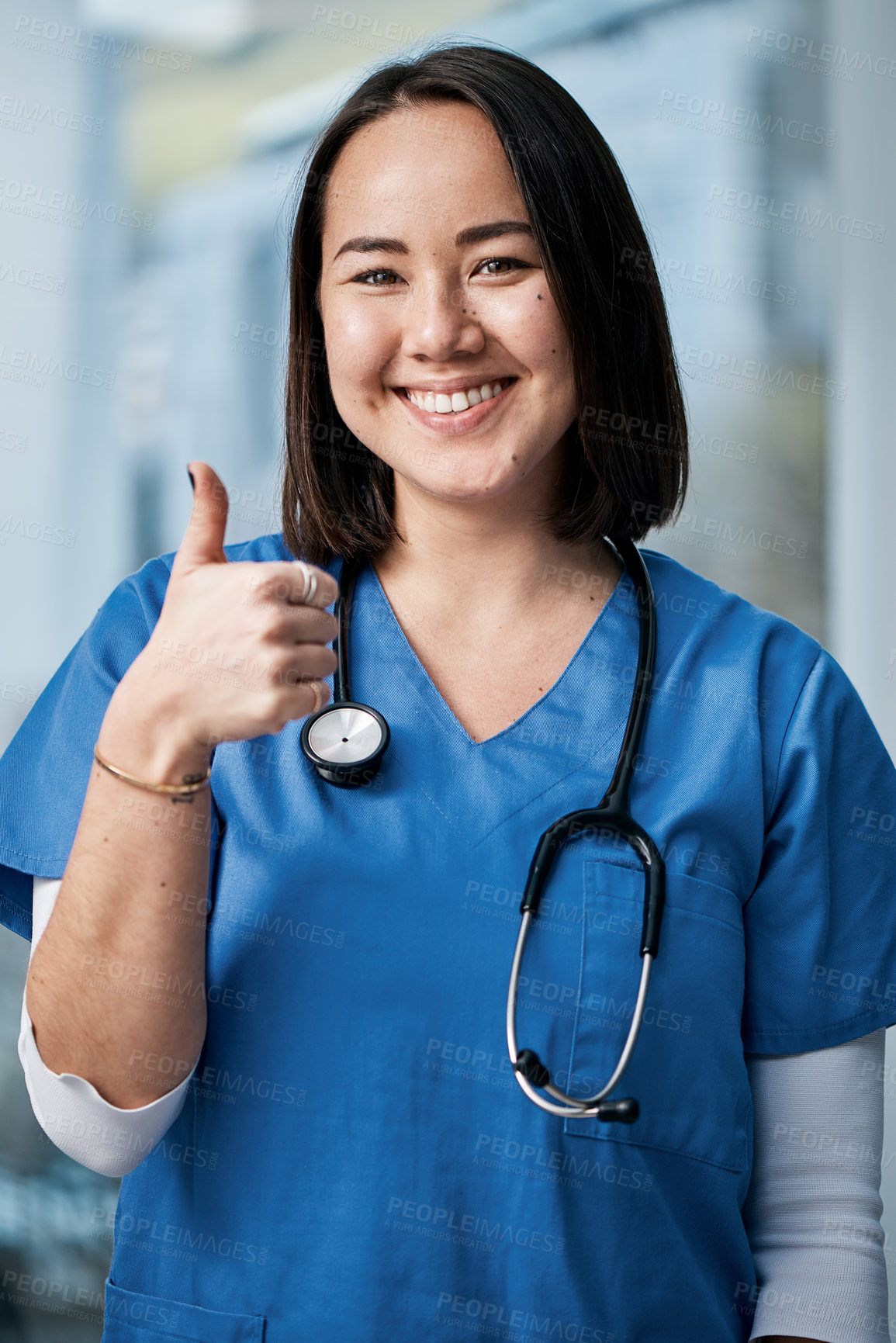 Buy stock photo Portrait of a medical practitioner showing thumbs up in a hospital