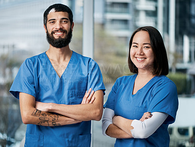 Buy stock photo Portrait of two medical practitioners standing together in a hospital