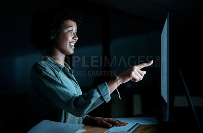 Buy stock photo Shot of a young businesswoman using a computer to make a video call during a late night at work