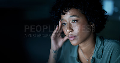 Buy stock photo Shot of a young businesswoman looking stressed during a late night at work