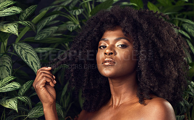 Buy stock photo Shot of a beautiful young woman posing against a leafy background