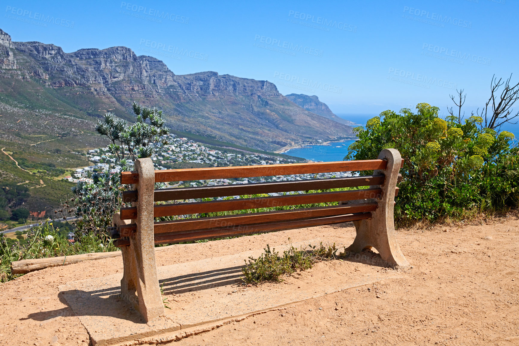 Buy stock photo Relaxing resting place along a mountain trail, with beauty in nature and peaceful harmony. Empty bench on Table Mountain, Cape Town, South Africa with a beautiful view of Lions Head and copy space. 