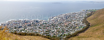 Buy stock photo Aerial and panoramic view of Cape Town, Western Cape in South Africa. Landscape view of an urban city surrounded by the sea and ocean for holidays and vacations during summer for tourists from above