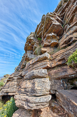 Buy stock photo Landscape scenic view of Table Mountain in Cape Town, South Africa against a blue sky in summer. Closeup of rocks on a natural landmark in a popular tourist city for hiking and adventure in nature