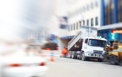 Buy stock photo Construction and roadworks in a street during an emergency in the city. Blurred and defocused view of a busy, blocked, and barricaded road downtown during renovations and revamping of buildings