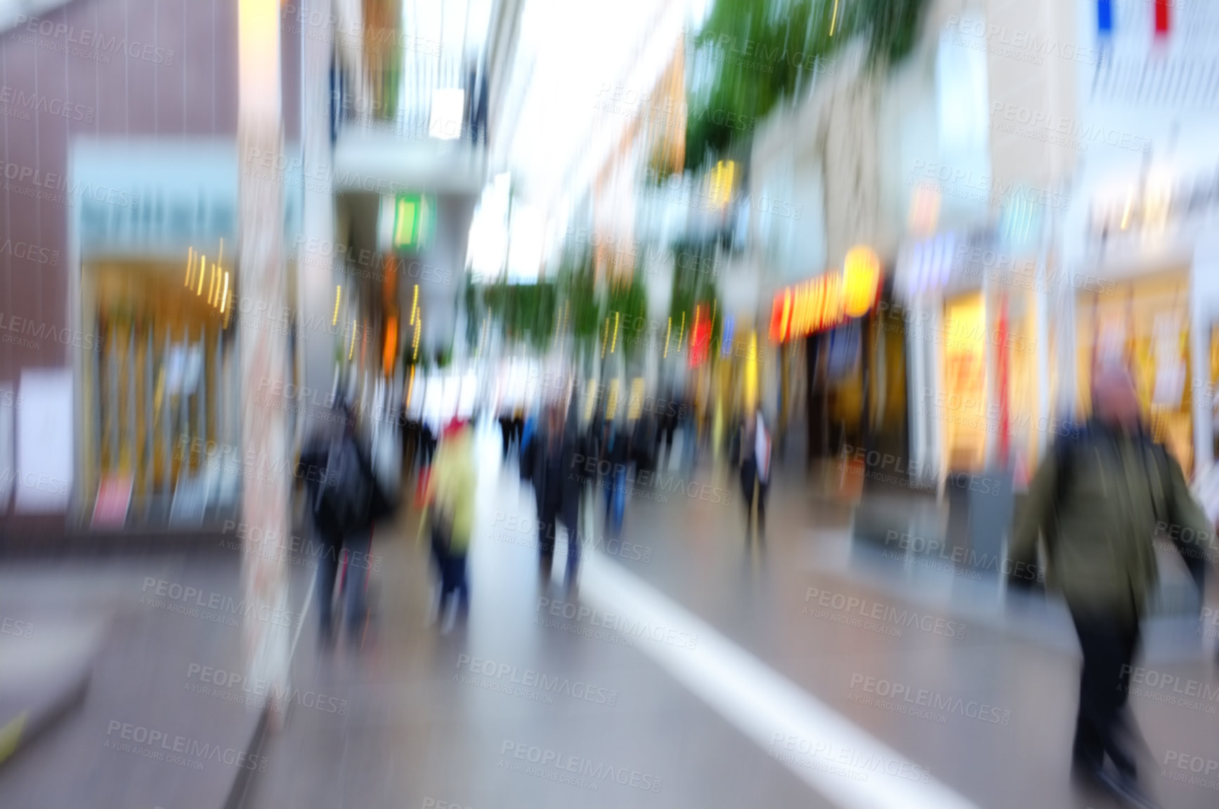 Buy stock photo Blurred motion of people traveling in a city outside. Defocused on crowd population of tourists, travelers and pedestrians exploring abroad while walking in a bustling and busy urban street downtown