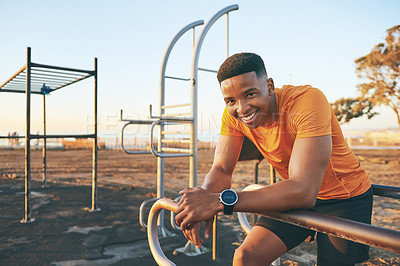 Buy stock photo Cropped shot of a young man looking happy while out at the park for a workout