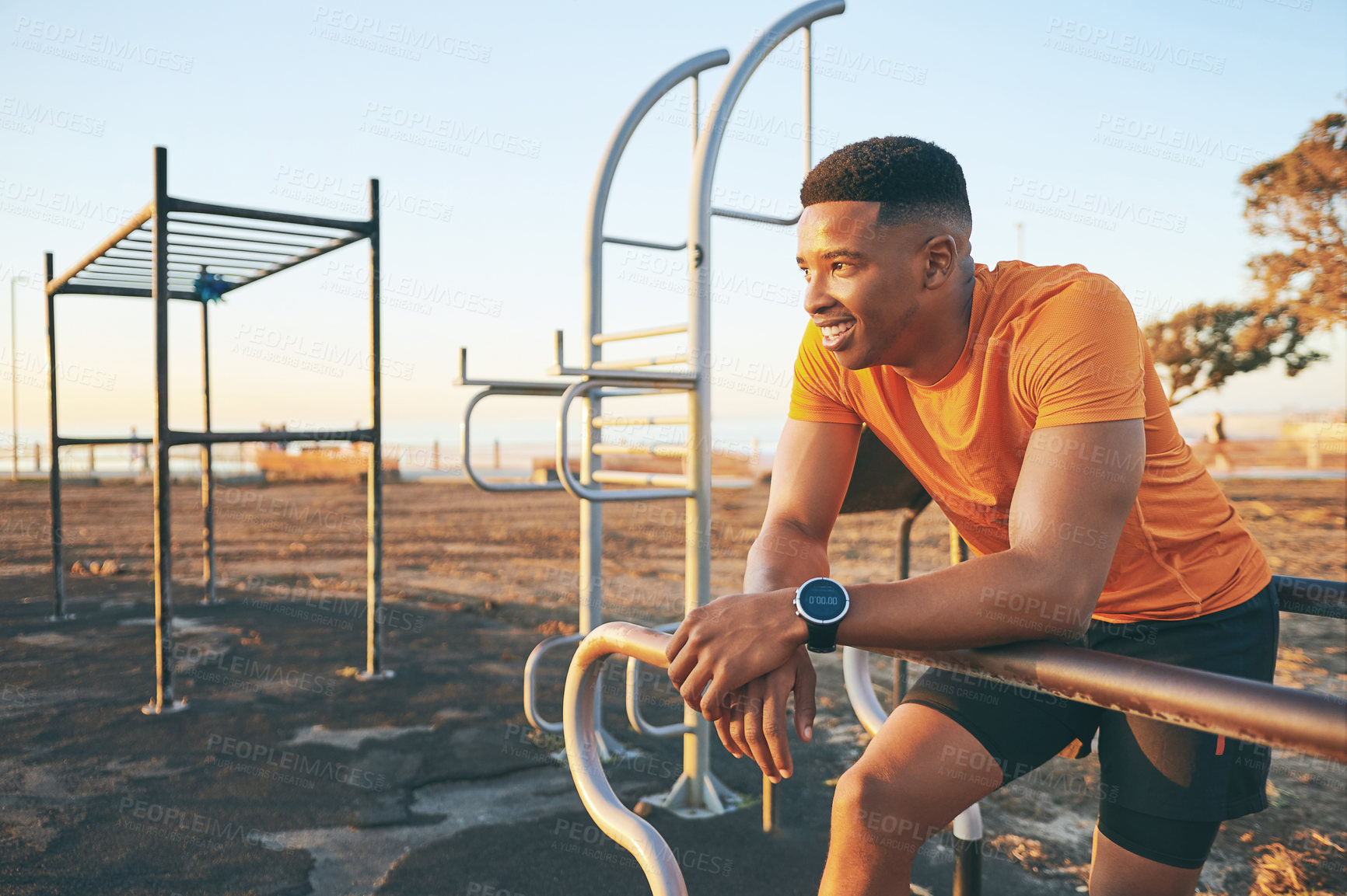 Buy stock photo Shot of a man checking his cellphone while out for a workout