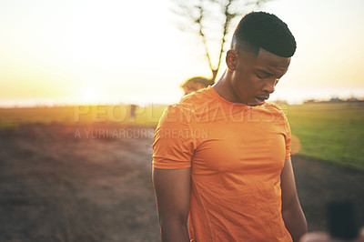 Buy stock photo Shot of a young man out for a workout at the park